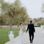 bride and groom walking at masseria muntibianchi