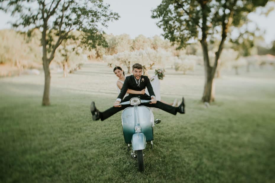 bride and groom on wedding motorcycle