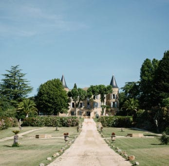 view up the driveway to beautiful chateau robernier French wedding venue
