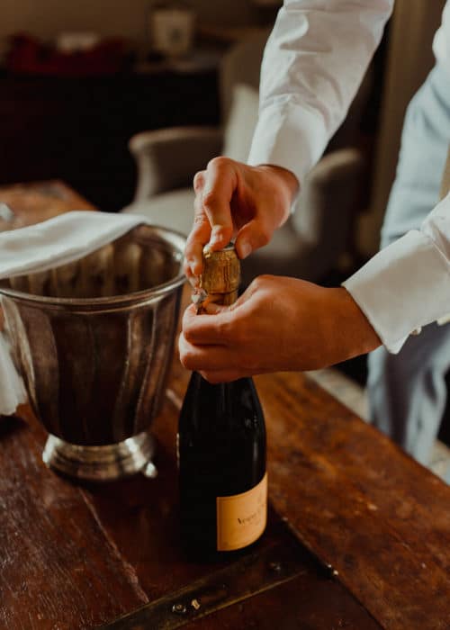 bartender preparing champagne at wedding