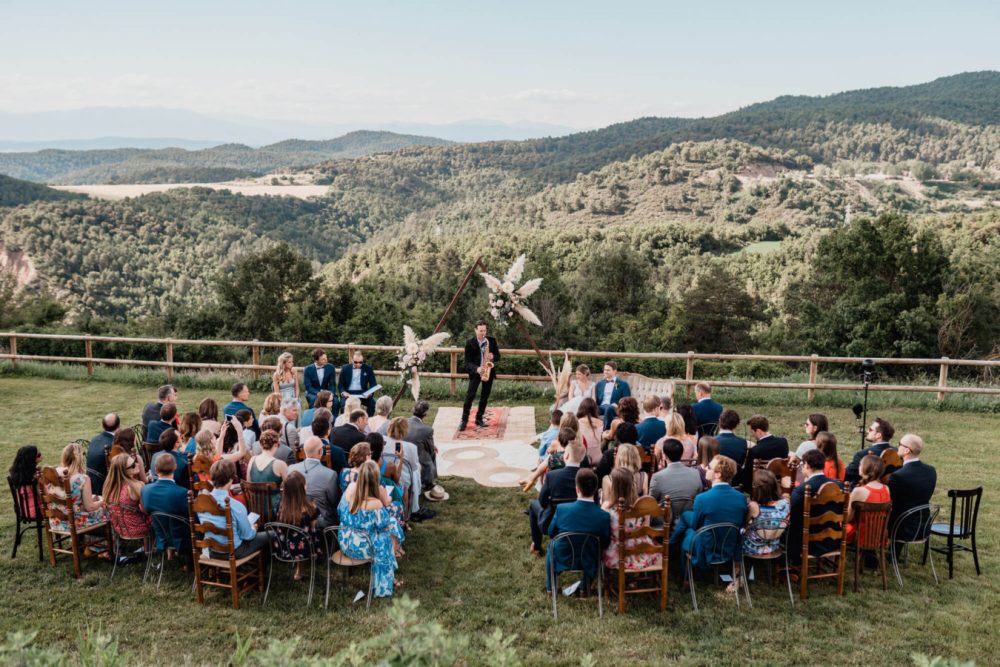 wedding ceremony on top of hill in spanish countryside with saxophonist performing at spanish wedding venue this must be the place