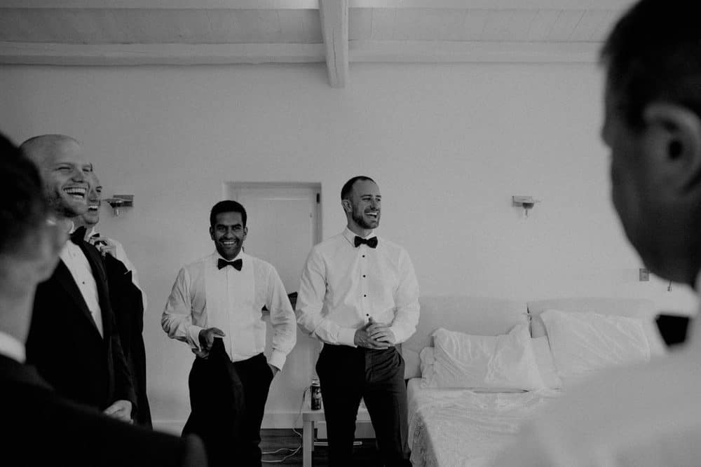best men clapping at wedding