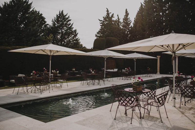 umbrellas by a bubbling pool at wedding villa