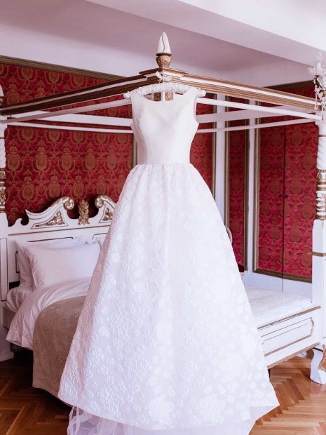 wedding gown hanging inside chateau de robernier bedroom