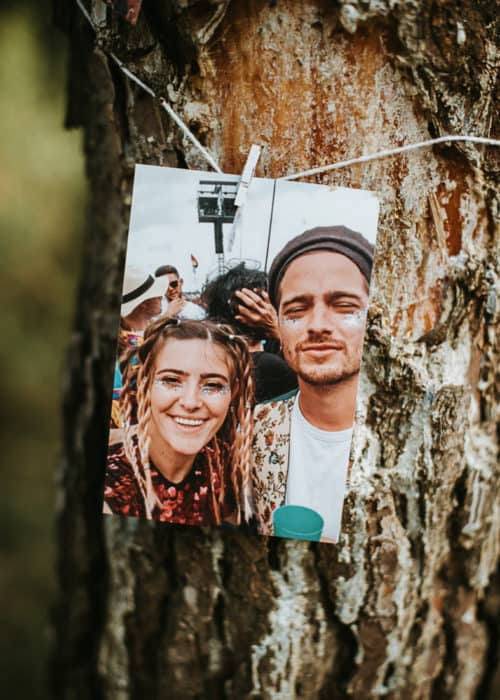 photo of bride and groom attached to tree