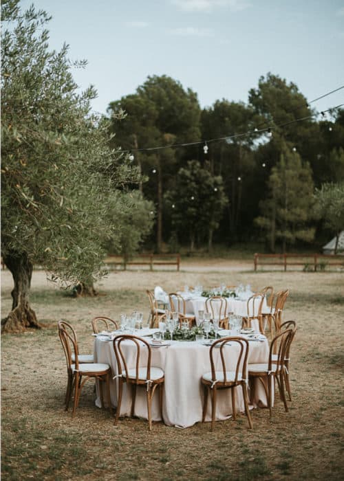 two outdoor wedding tables at spanish venue
