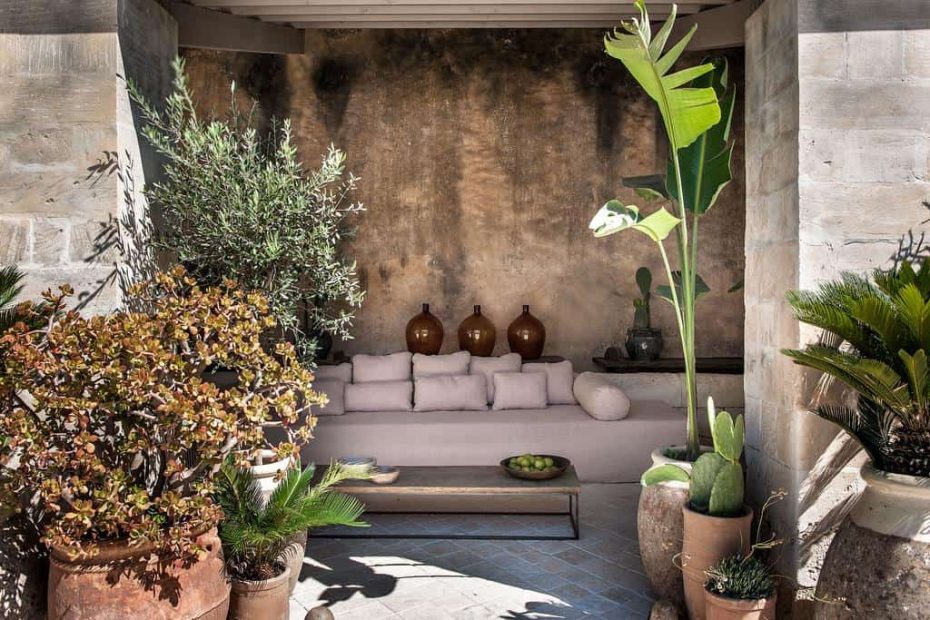 shaded seating area with potted plants