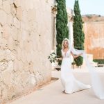 bride twirling with her veil before wedding ceremony at cap rocat wedding venue mallorca in spain