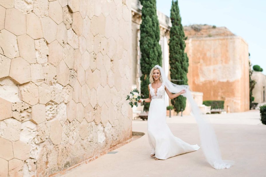 bride twirling with her veil before wedding ceremony at cap rocat wedding venue mallorca in spain