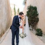 bride and groom kiss in mallorca wedding venue cap rocat