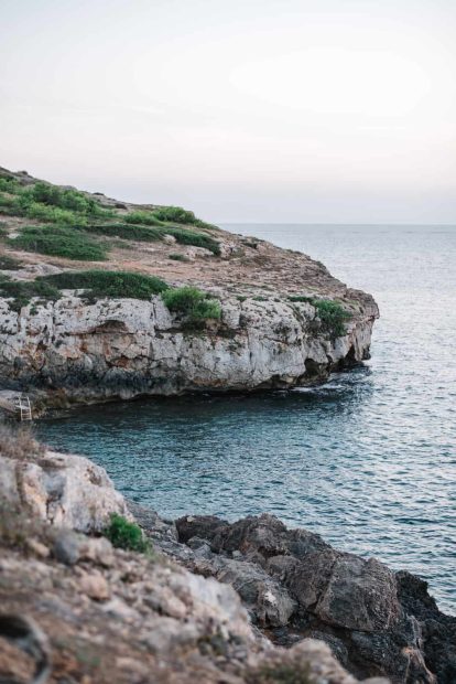 A shot of the rocky coastline at Kat and Alex's Cap Rocat wedding in Mallorca