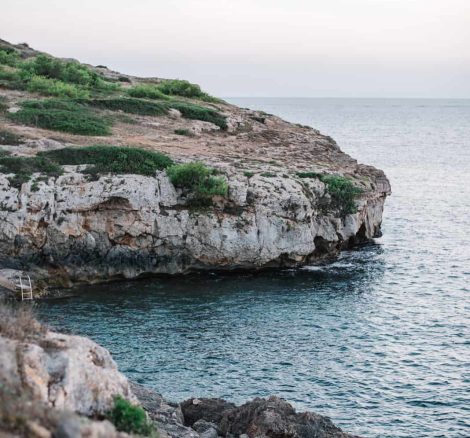 A shot of the rocky coastline at Kat and Alex's Cap Rocat wedding in Mallorca