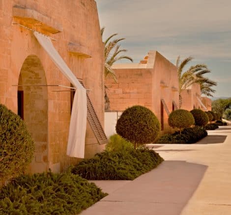 Cap Rocat exterior shot of grounds, with beautiful stone walls and arched doorways at cap rocat Wedding Venue in Mallorca Spain