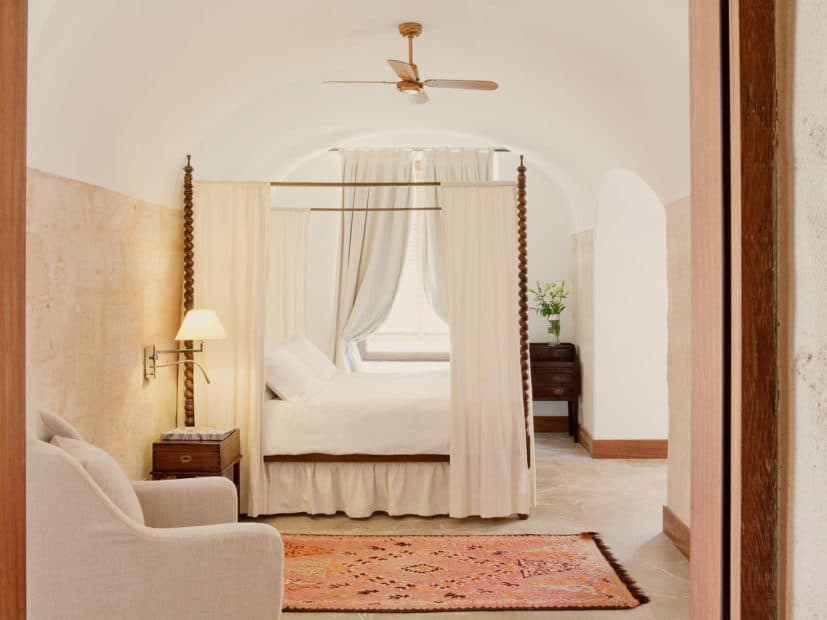 side view of four poster bed in a suite at cap rocat wedding venue in mallorca
