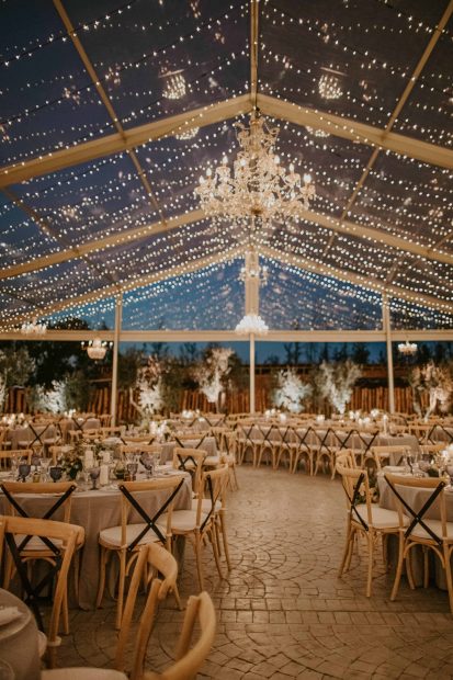 wedding tables with hanging fairy lights zoomed in