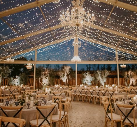 wedding tables with hanging fairy lights zoomed in