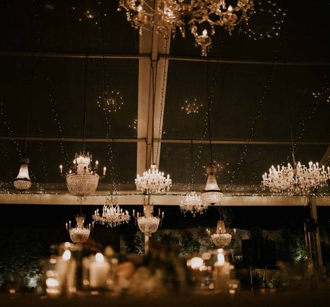 multiple chandeliers light up wedding night