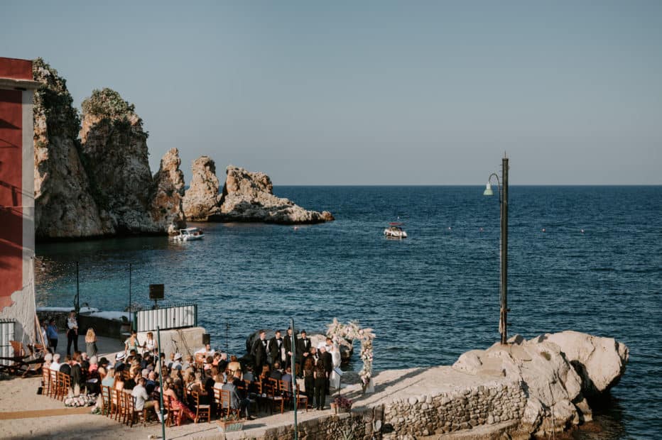 wedding taking place by the ocean