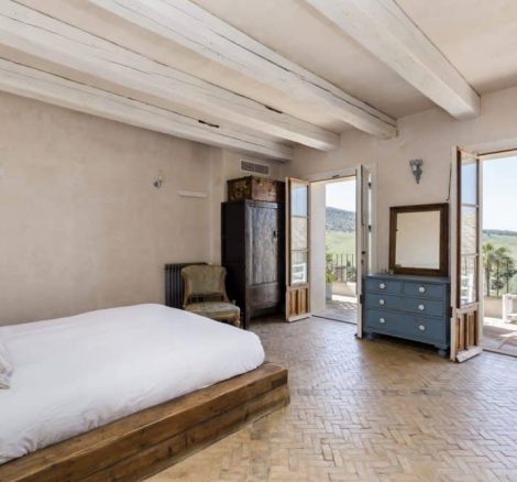 white bed and blue makeup desk at at spanish wedding venue casa la siesta in spain