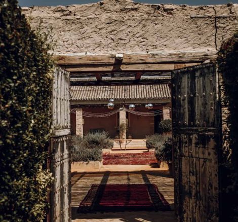 iron riveted door leading to casa la siesta wedding venue in spain