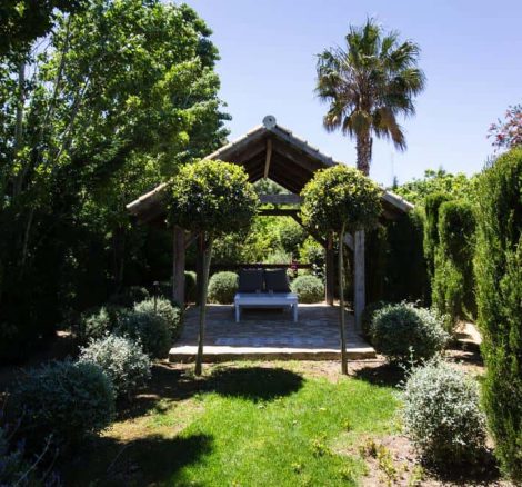 shaded undercover area with white table at wedding villa casa la siesta in spain