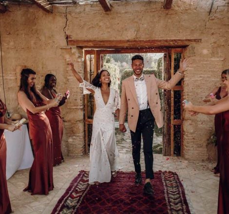 jess and adam waving to bridesmaids spanish wedding venue casa la siesta