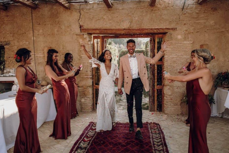 jess and adam waving to bridesmaids spanish wedding venue casa la siesta