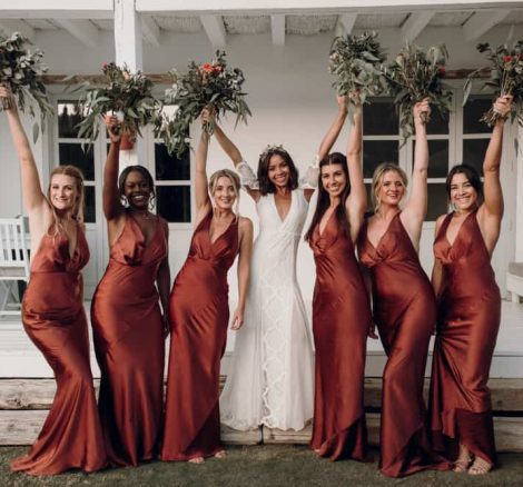 bride and bridesmaids holding up their bouquets spanish wedding venue casa la siesta