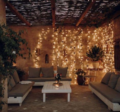 rustic seating area with dangling fairy llights spanish wedding venue casa la siesta