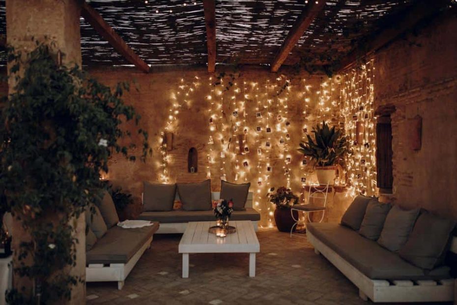 rustic seating area with dangling fairy llights spanish wedding venue casa la siesta