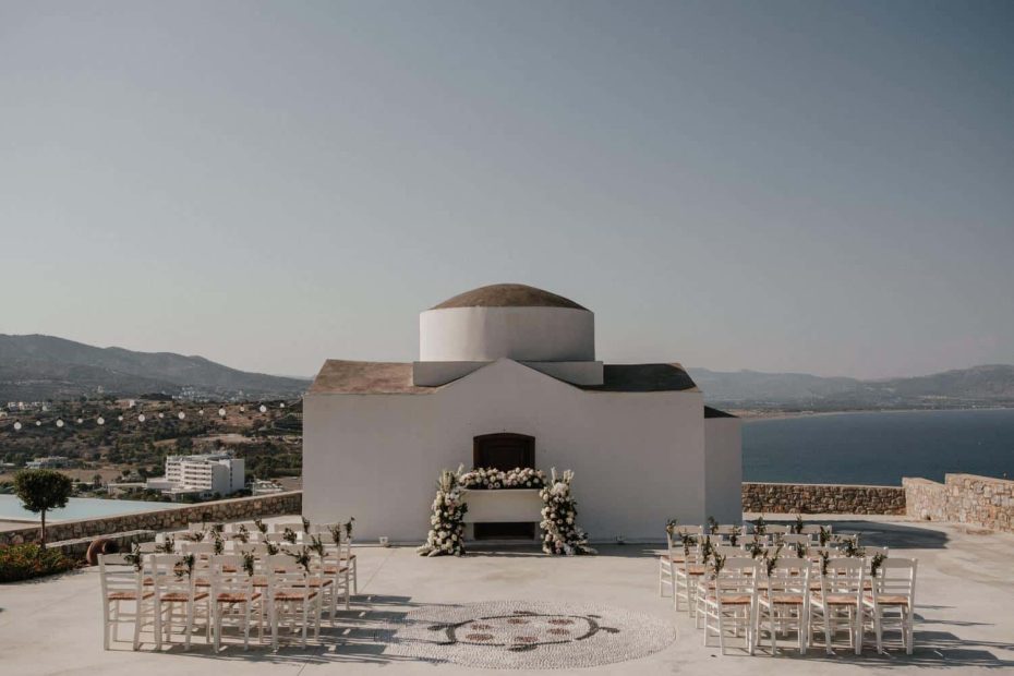 small sitting area outside white chapel wedding location