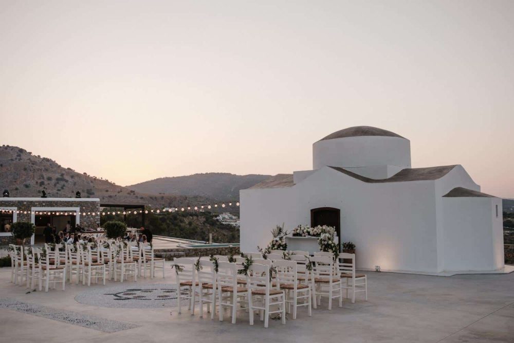 empty chairs outside a ktima lindos wedding venue in rhodes