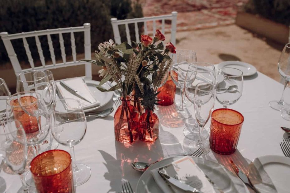 orange glassware on wedding table spanish wedding venue casa la siesta