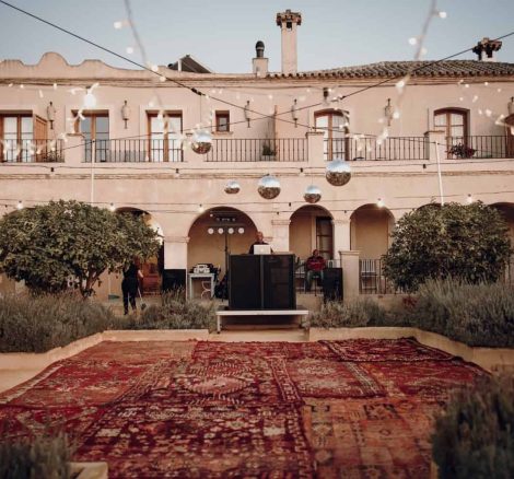 bohemian carpeted outdoor area at casa la siesta spanish wedding venue