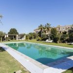 long swimming pool with chill out area at spanish wedding venue casa la siesta in spain