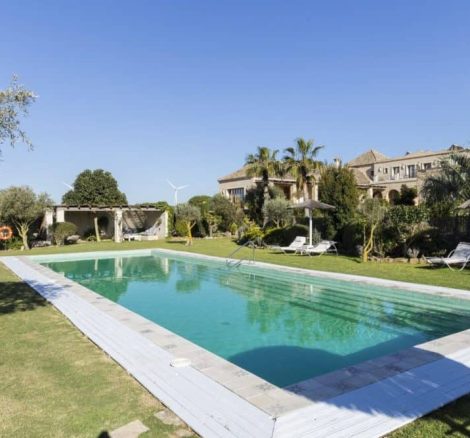 long swimming pool with chill out area at spanish wedding venue casa la siesta in spain