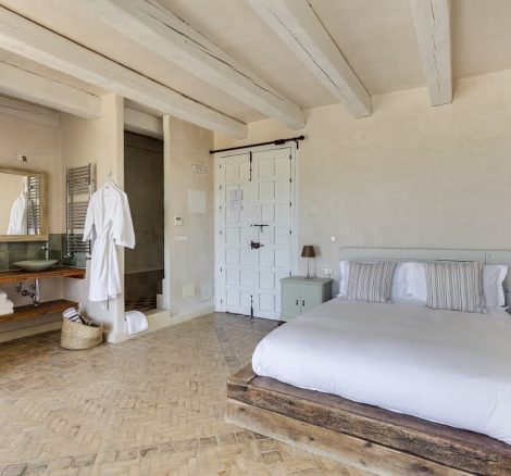 white bath gown hanging for the bride ready in the bridal suite at spanish wedding venue casa la siesta in spain