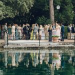 wedding guests gathered near pool at finca comassema