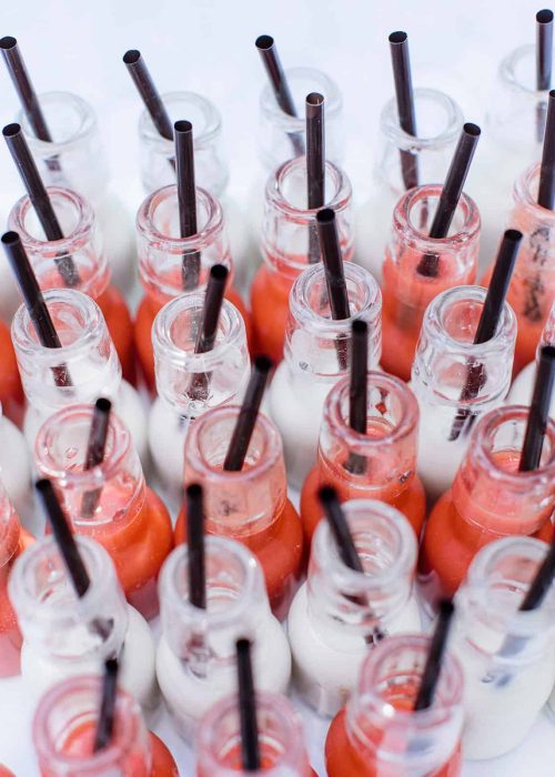 bottles of wedding drinks with straws