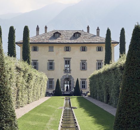View looking up through the neatly manicured gardens at luxury wedding venue villa balbiano in lake como Italy