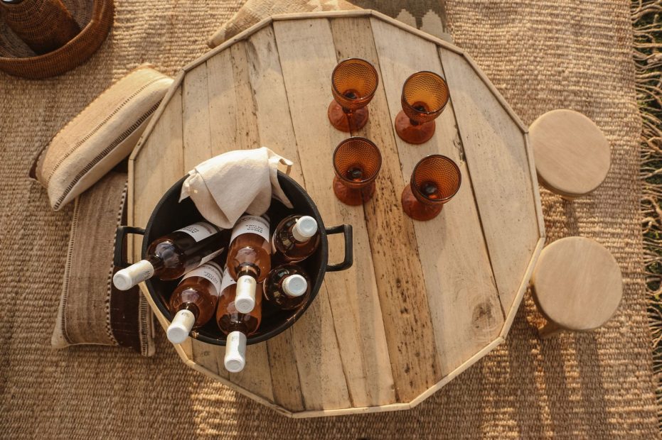 shot above a wooden table with drinks laid out at terra rosa country house and vineyards wedding venue in portugal