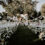 The view up the aisle of an outdoor ceremony at Italian wedding venue Masseria Don Luigi
