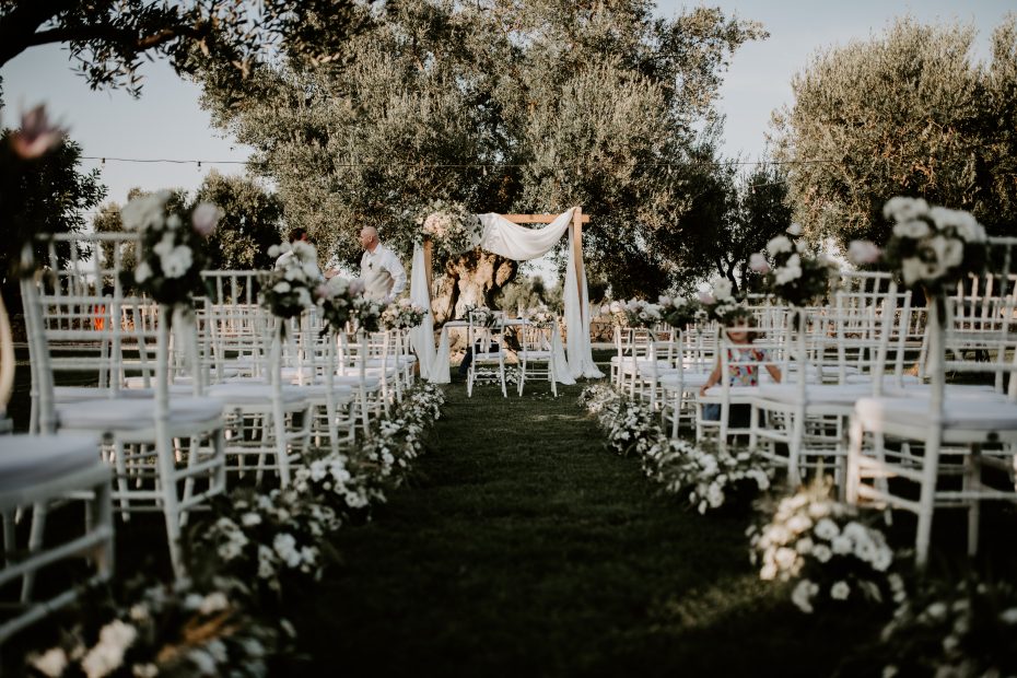 The view up the aisle of an outdoor ceremony at Italian wedding venue Masseria Don Luigi