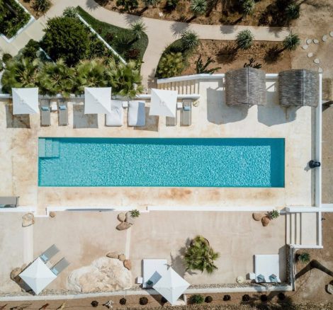 aerial shot above the long rectangular outdoor pool at pure house ibiza wedding venue