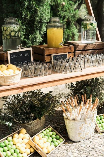 display of glass jars and fruit for a summer wedding at mallorca wedding venue son doblons in spain