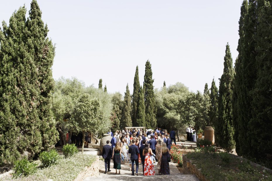 wedding guests mingling outside before the wedding ceremony at mallorca wedding venue son doblons in spain