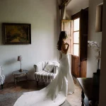 bride looking out of the window at villa catalina