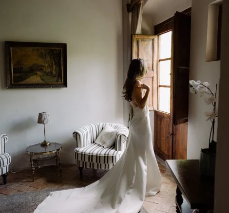 bride looking out of the window at villa catalina