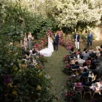 garden wedding ceremony view from above with pink florals at villa catalina in Spain