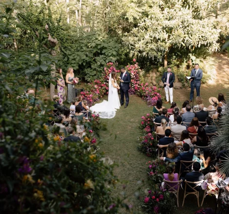 garden wedding ceremony view from above with pink florals at villa catalina in Spain